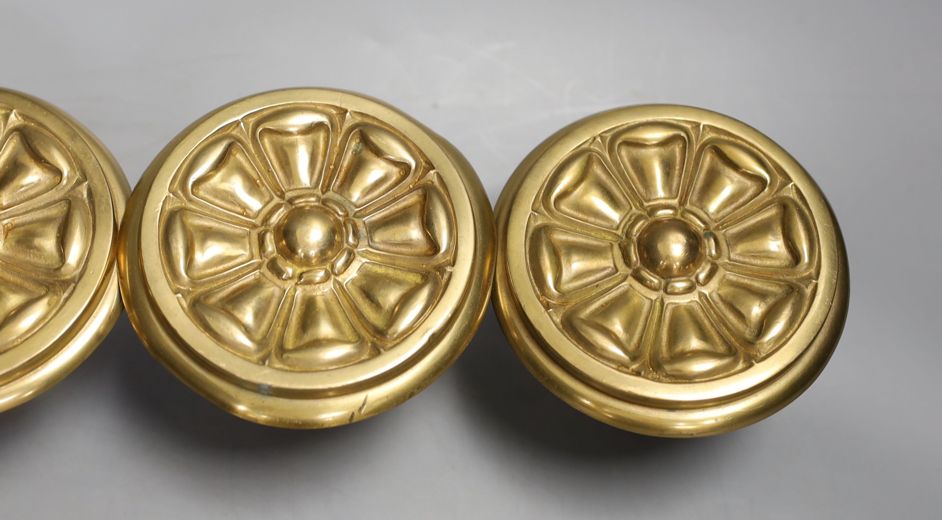 Four floral brass curtain tiebacks - 11cm diameter